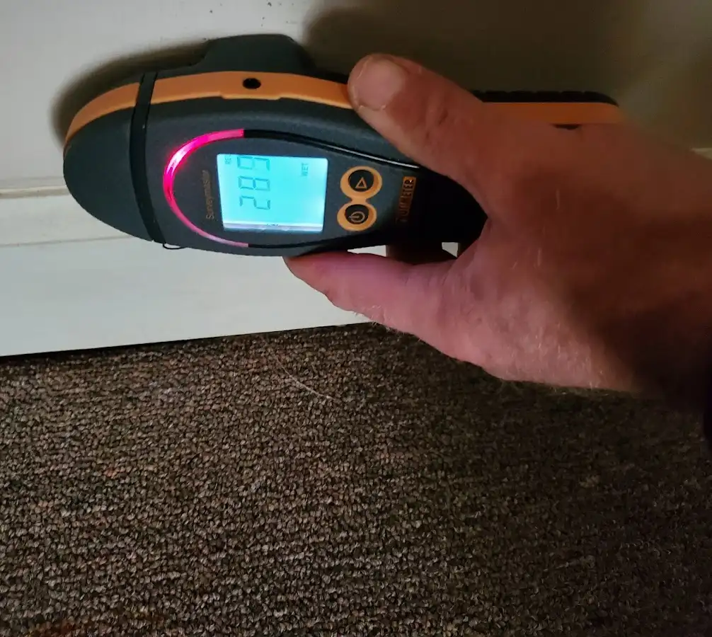 Moisture detection at baseboard during Storm Damage Restoration in South Plainfield